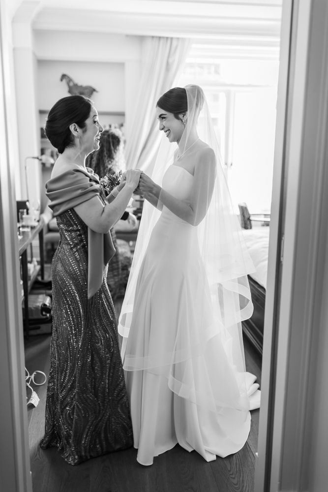 bride and her mother sharing a moment of love