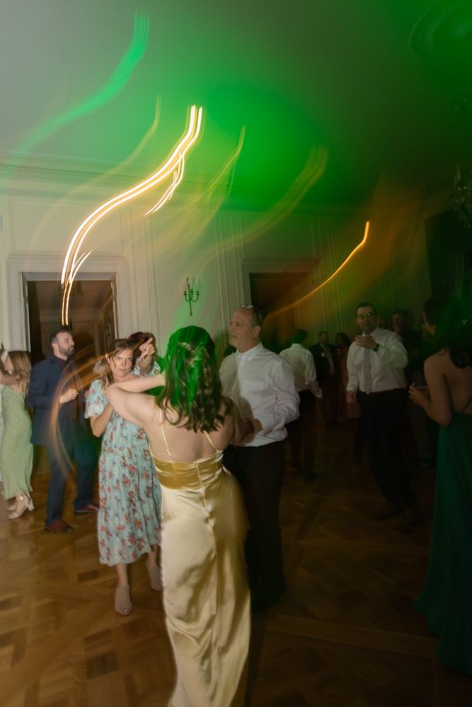 guests dancing in ballroom at wedding reception