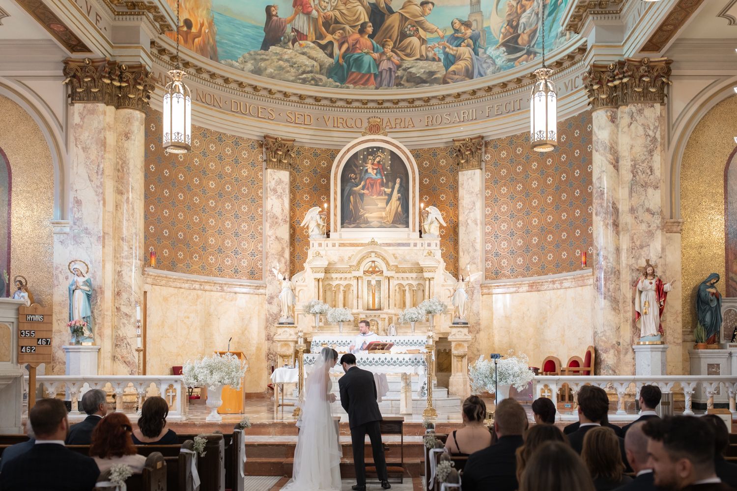 bride and groom talking to each other at church