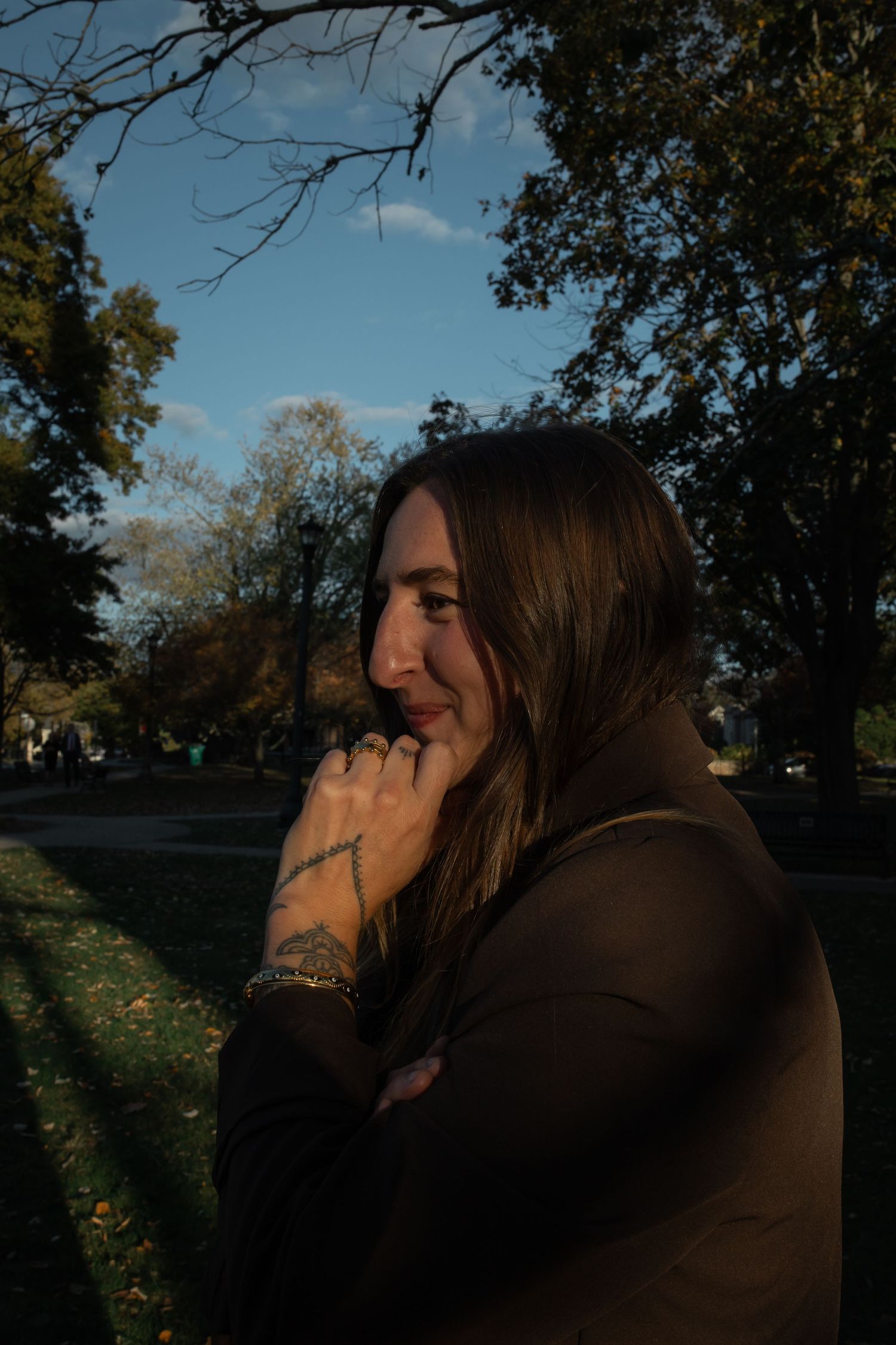 Woman looks on adoringly in a park setting