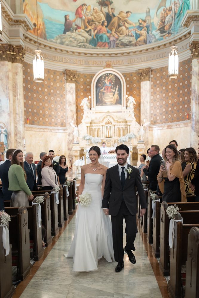 bride and groom walking down the isle
