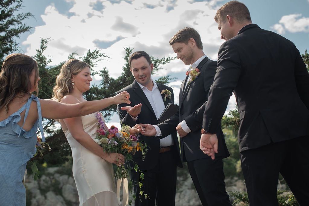 ring exchange at outdoor wedding ceremony