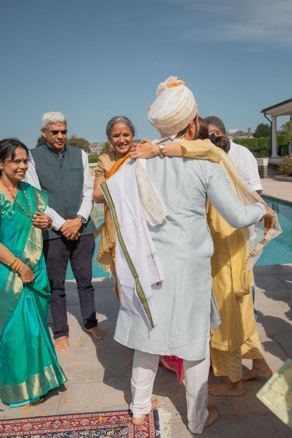 guests embrace the groom joyfully