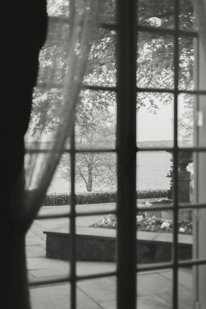 black and white photo of window in french chateau