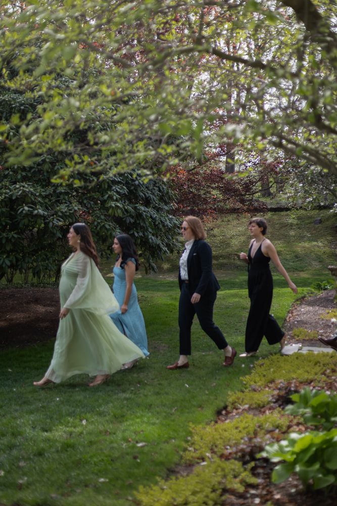 wedding guests arriving to garden ceremony