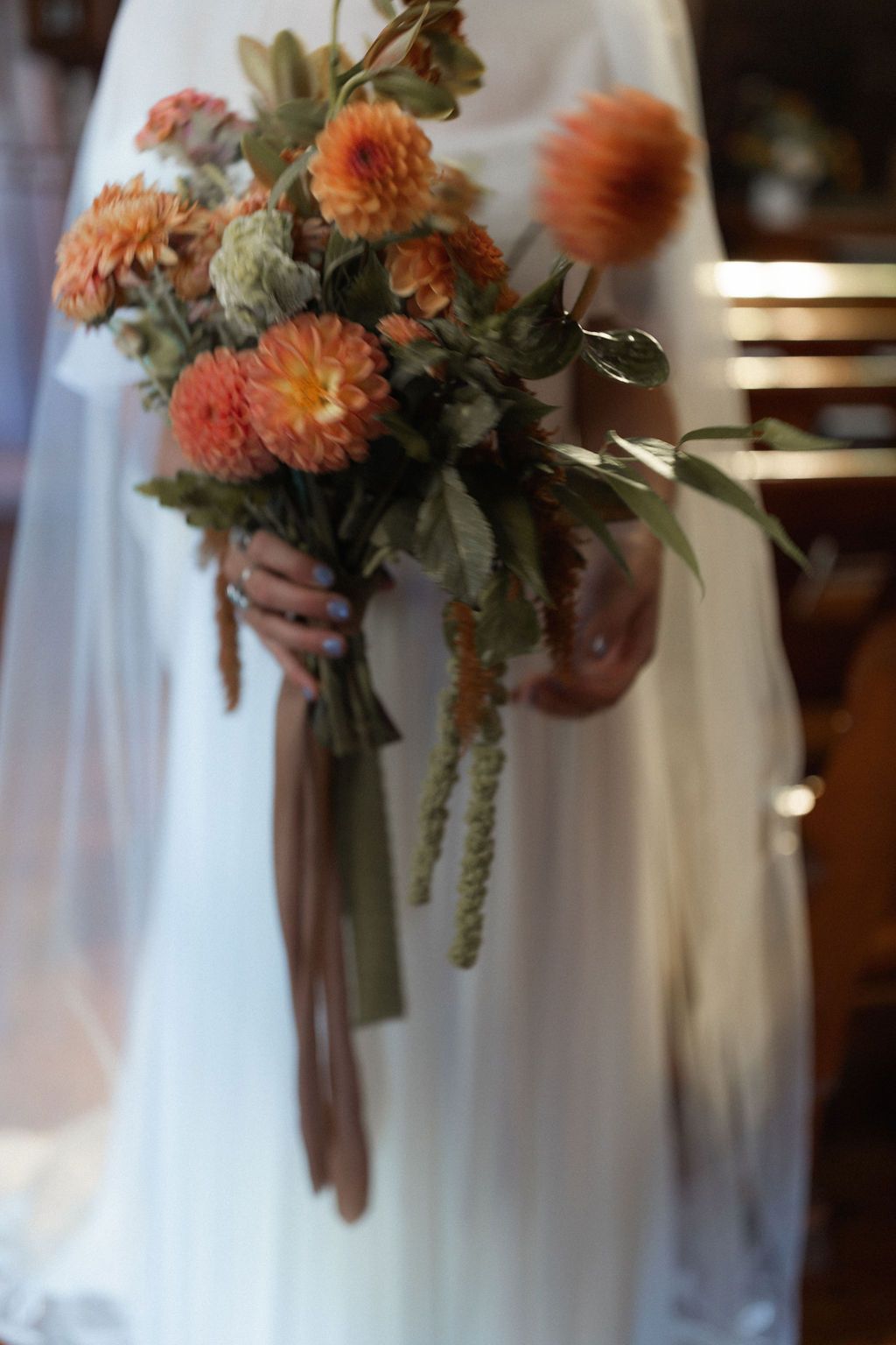 Peach and coral colored chrysanthemum wedding bouquet