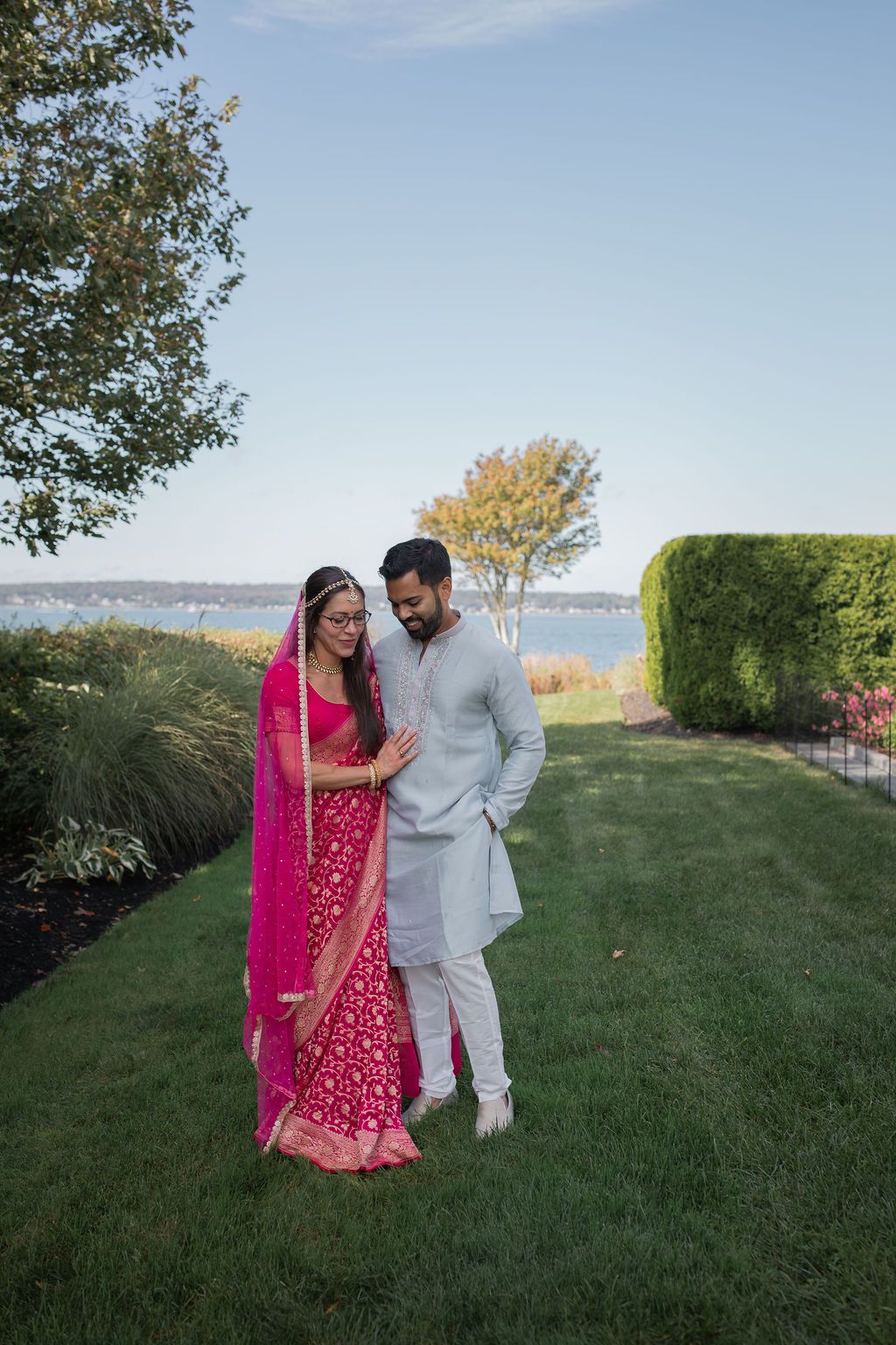 indian wedding couple stand together smiling