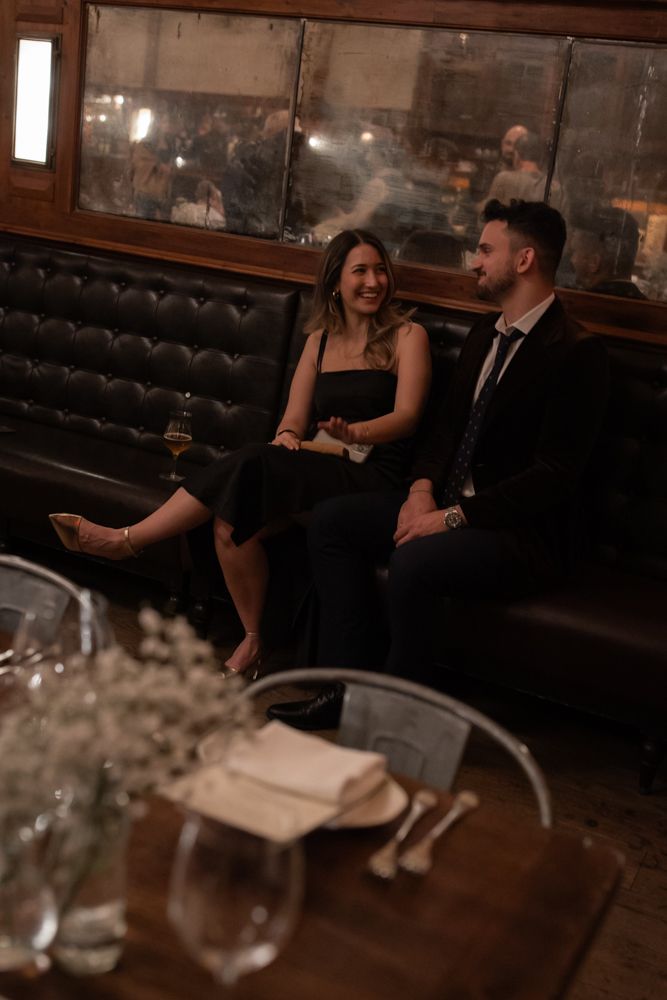wedding guests smiling on bench