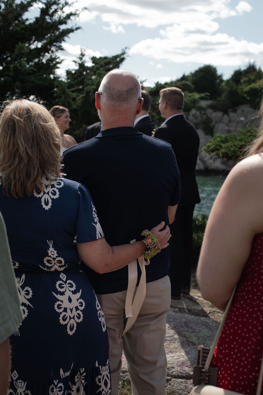 wedding guests look on affectionately