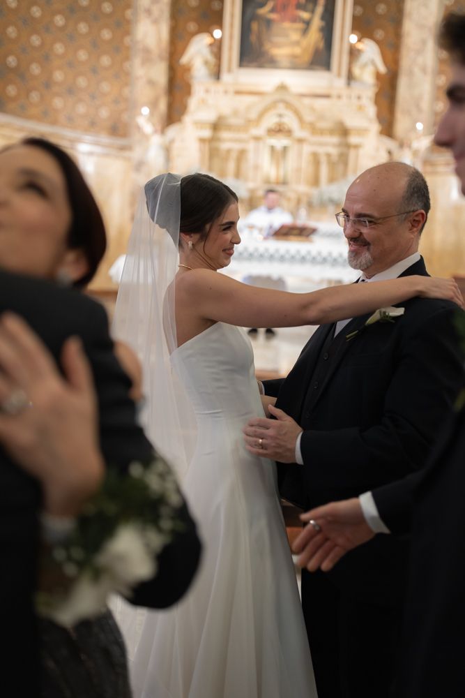bride hugging father at ceremony