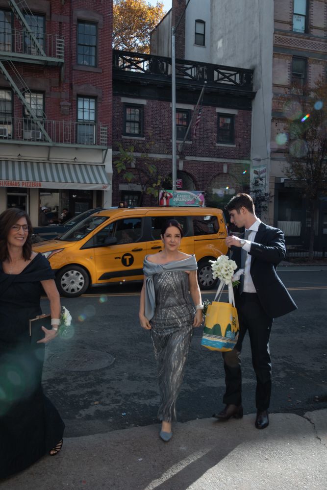 two people crossing the street in new york city