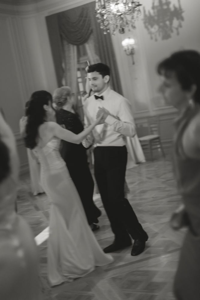 black and white photo of bride and groom dancing at wedding reception