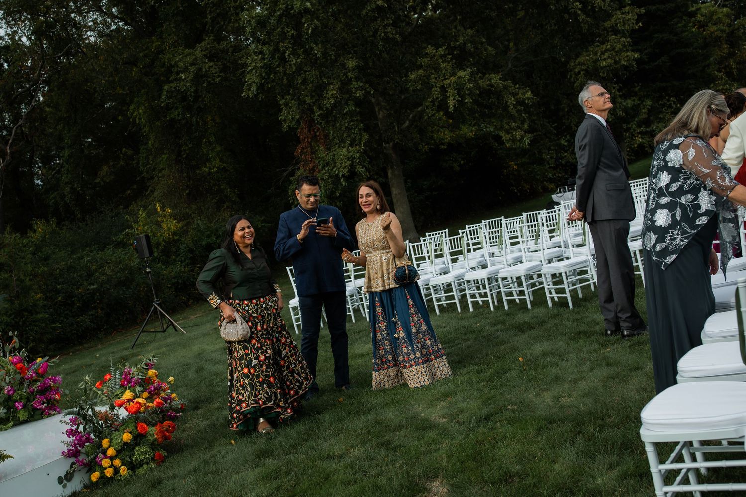 guests wait for ceremony to start in front of garden chairs
