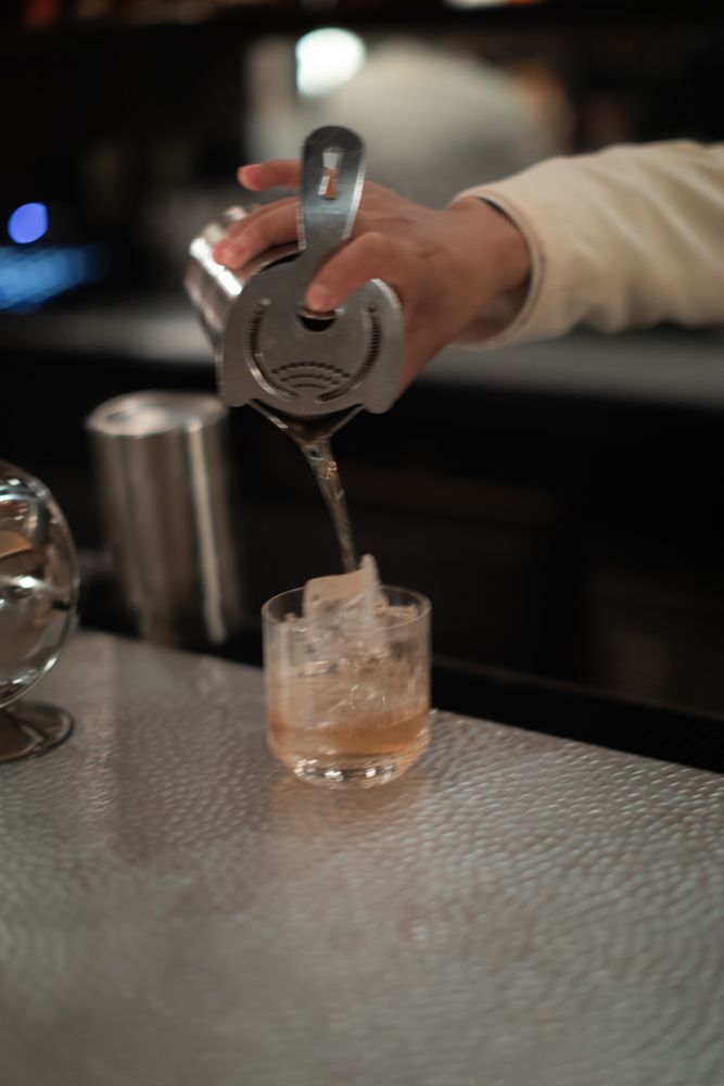bartender pouring a drink