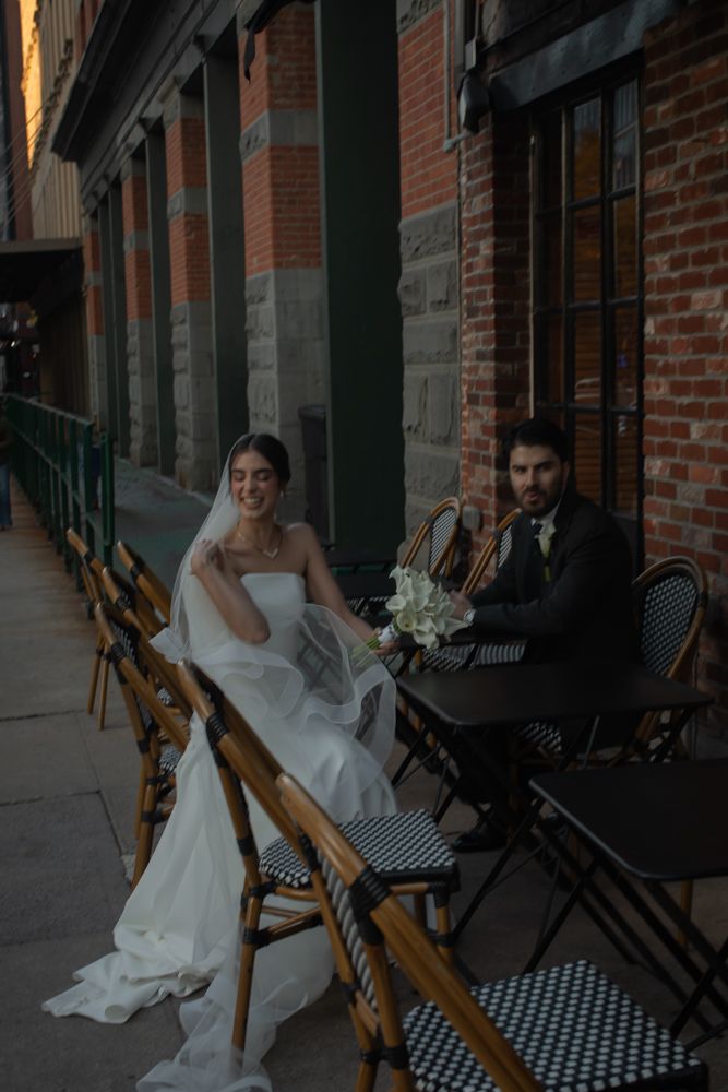bride and groom sitting outside in new york