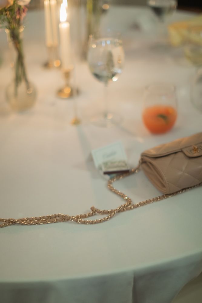 candlelit table with purse
