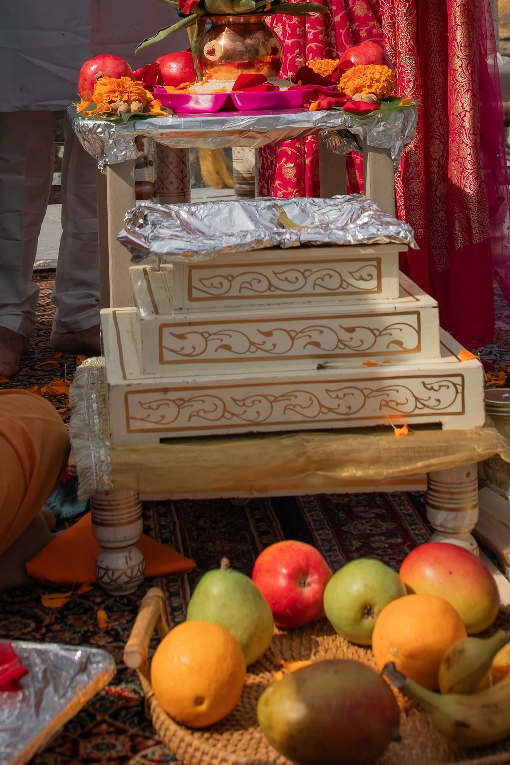 indian wedding decorations with a bowl of fruit