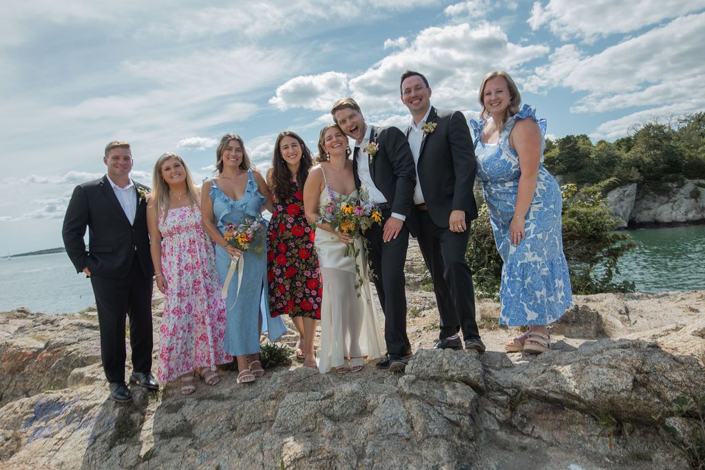 wedding group portrait near the ocean