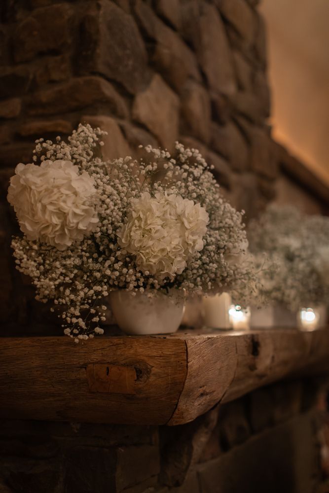baby's breath floral arrangement on mantle