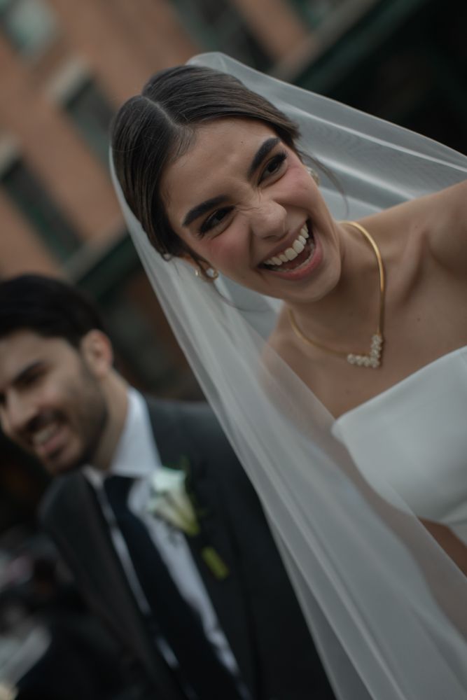 bride and groom laughing