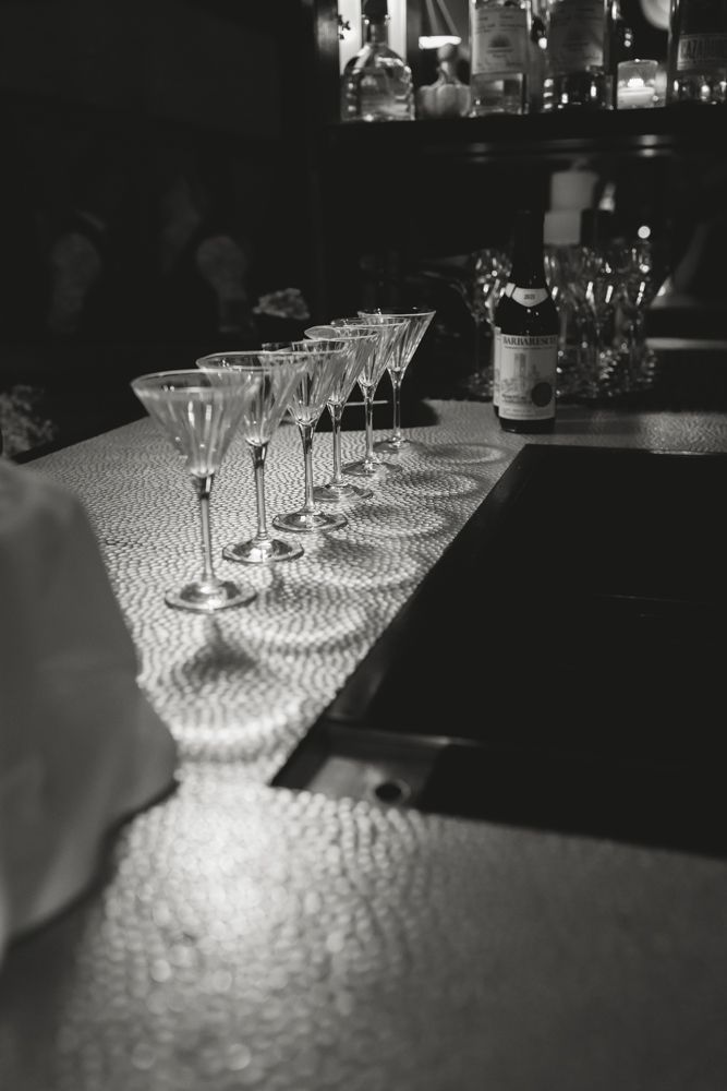 glasses lined up on the bar top