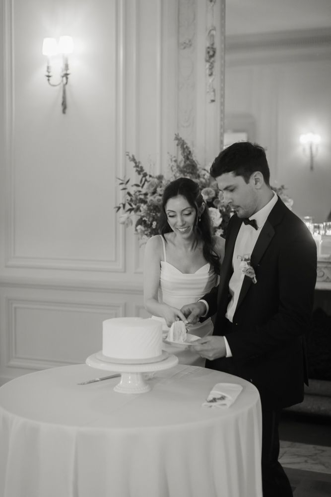 bride and groom cutting wedding cake
