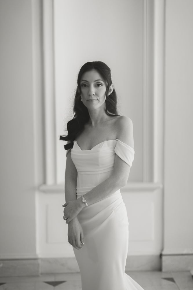 black and white photo of bride looking at the camera