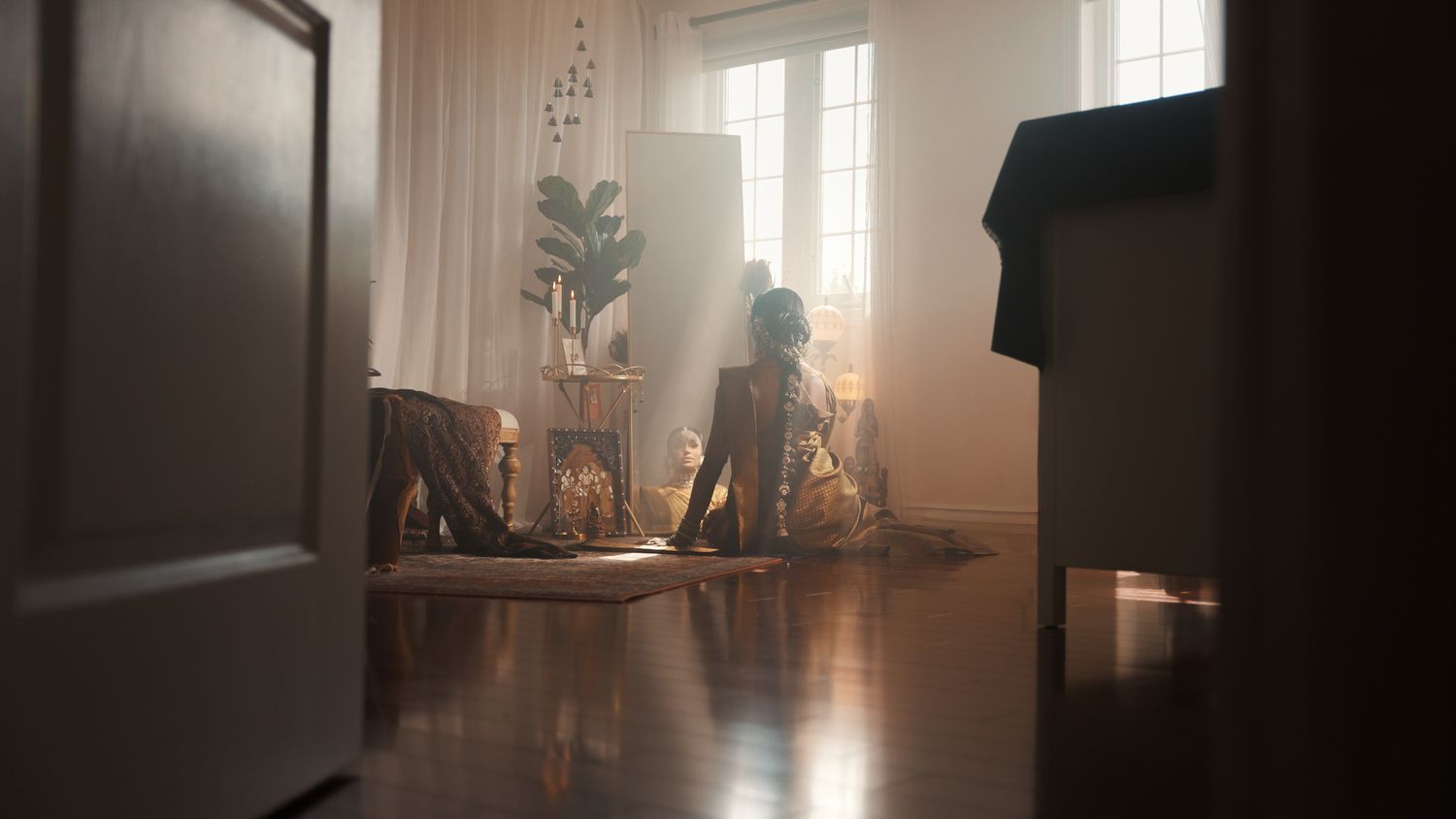Sunlit interior room with large windows creating a warm, atmospheric glow.