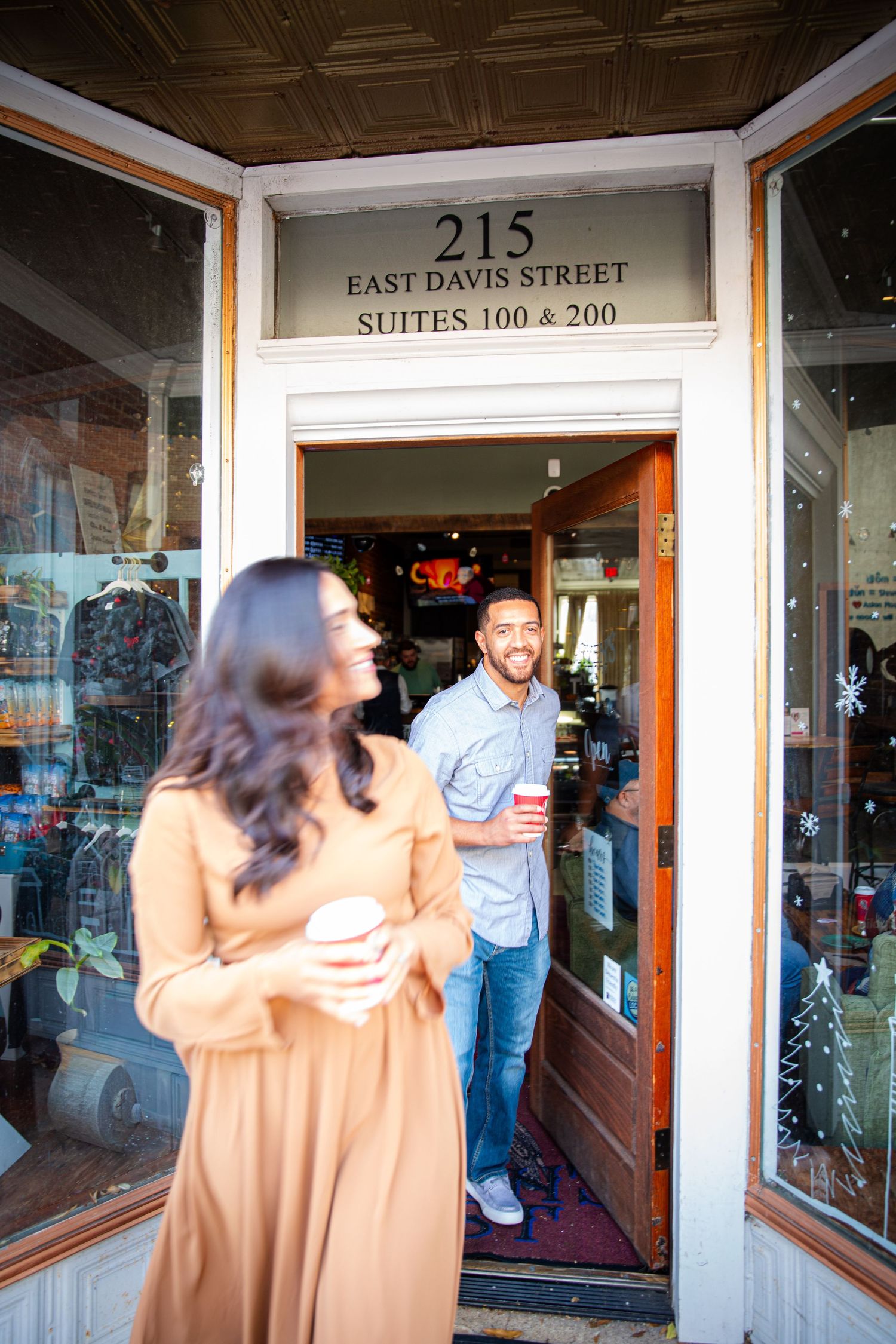 Couple exiting a cafe