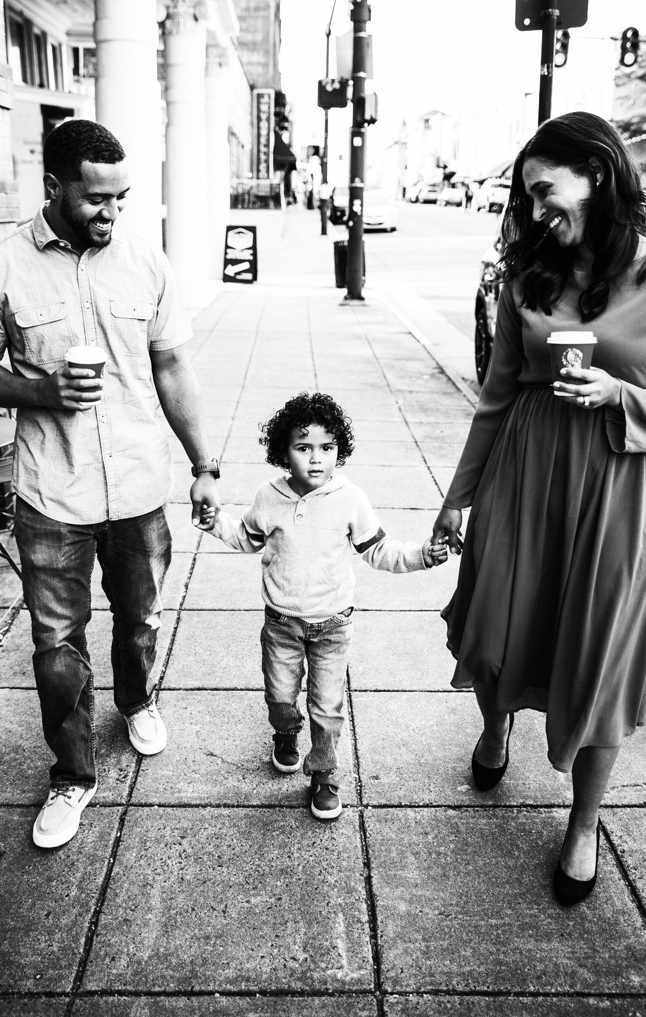 Family  of three sharing a moment taking a walk