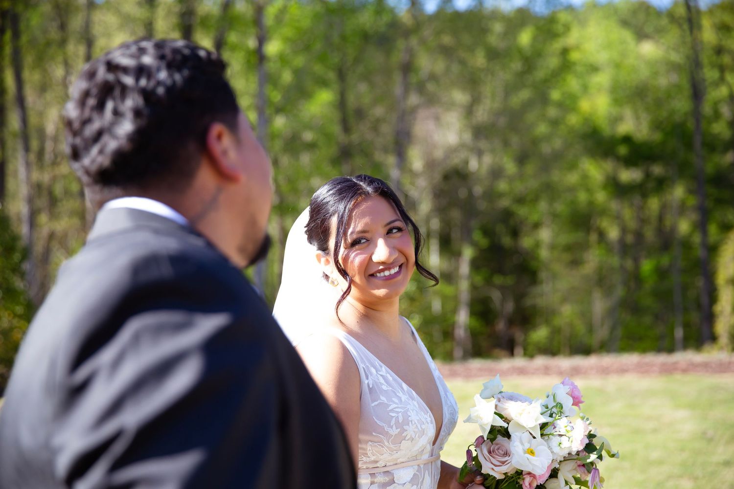 Bride looking lovingly into groom's eyes