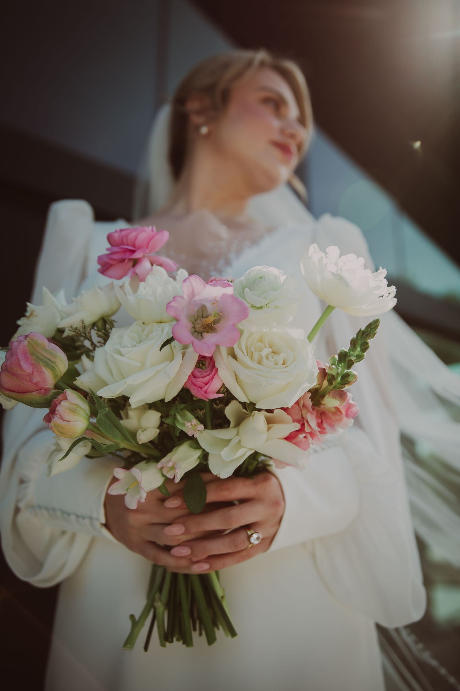Bride with pink and white flowers