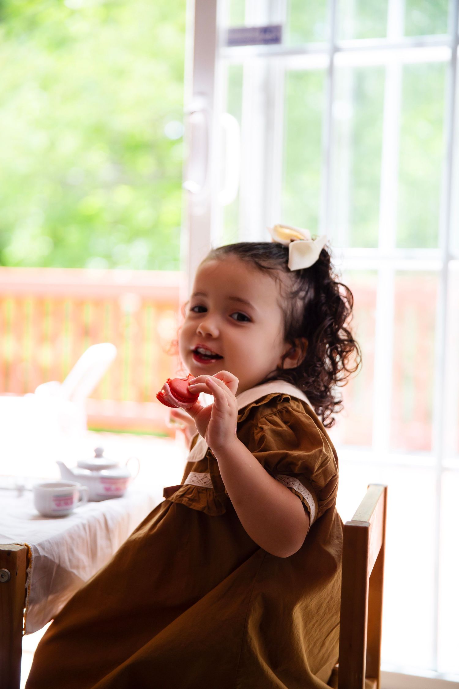 Toddler girl at a tea party