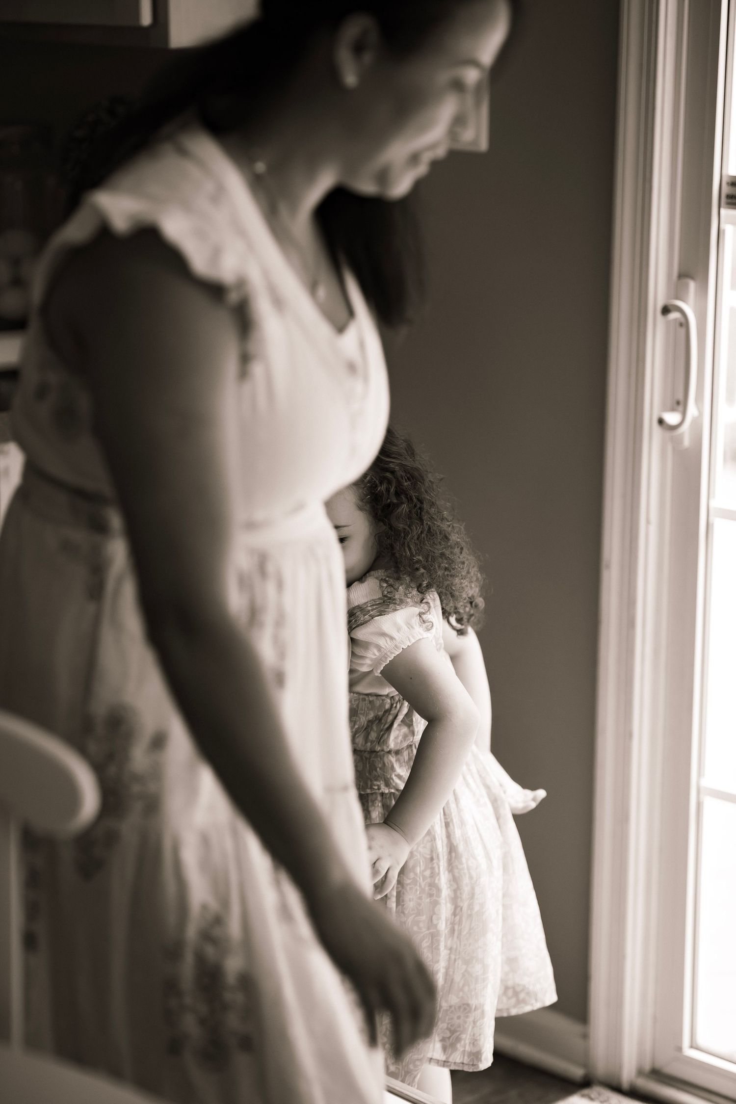 Mom and little girl play dance in a circle