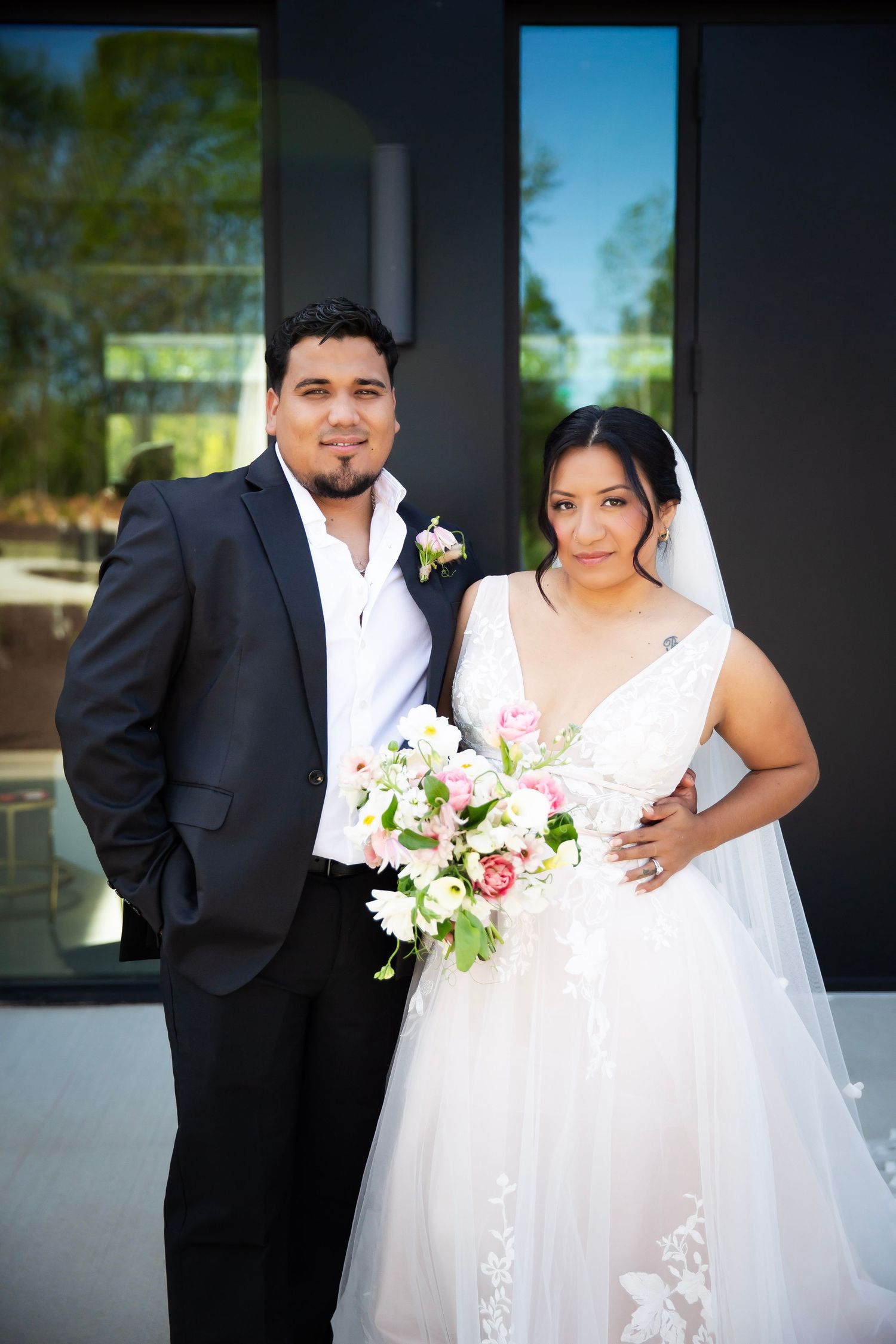 Bride and Groom looking into the camera