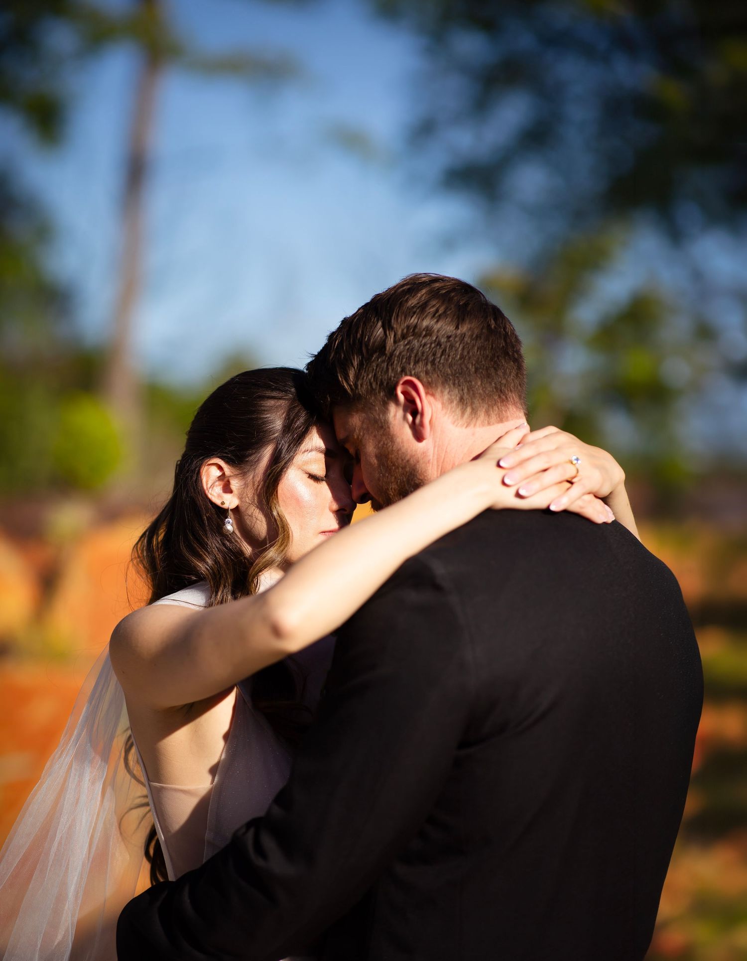 Bride and groom embracing