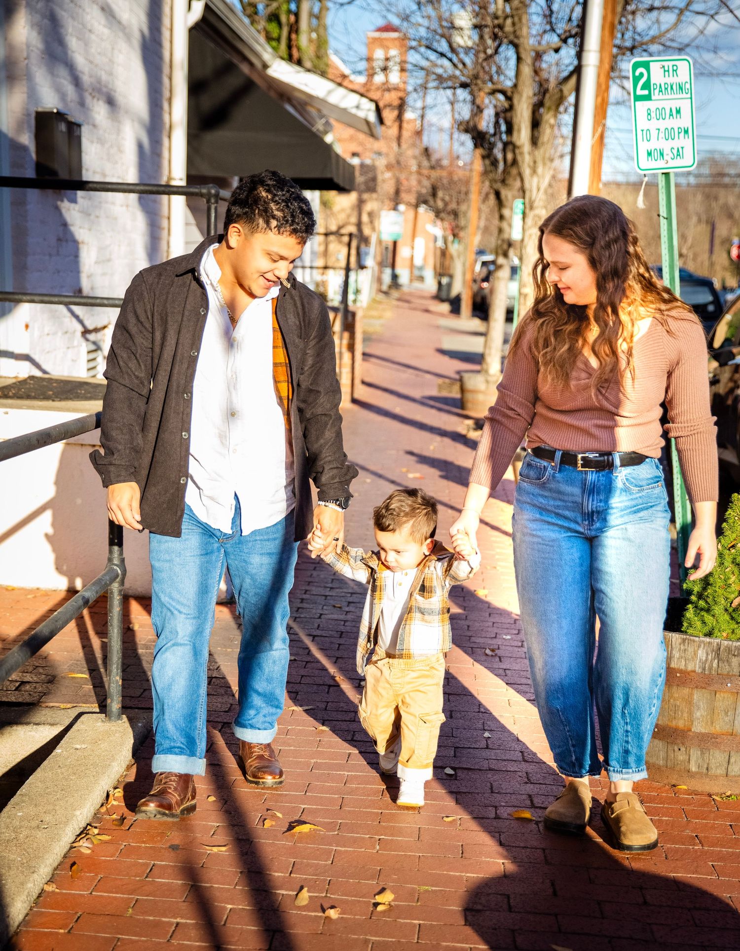 Family  of three sharing a moment in golden hour