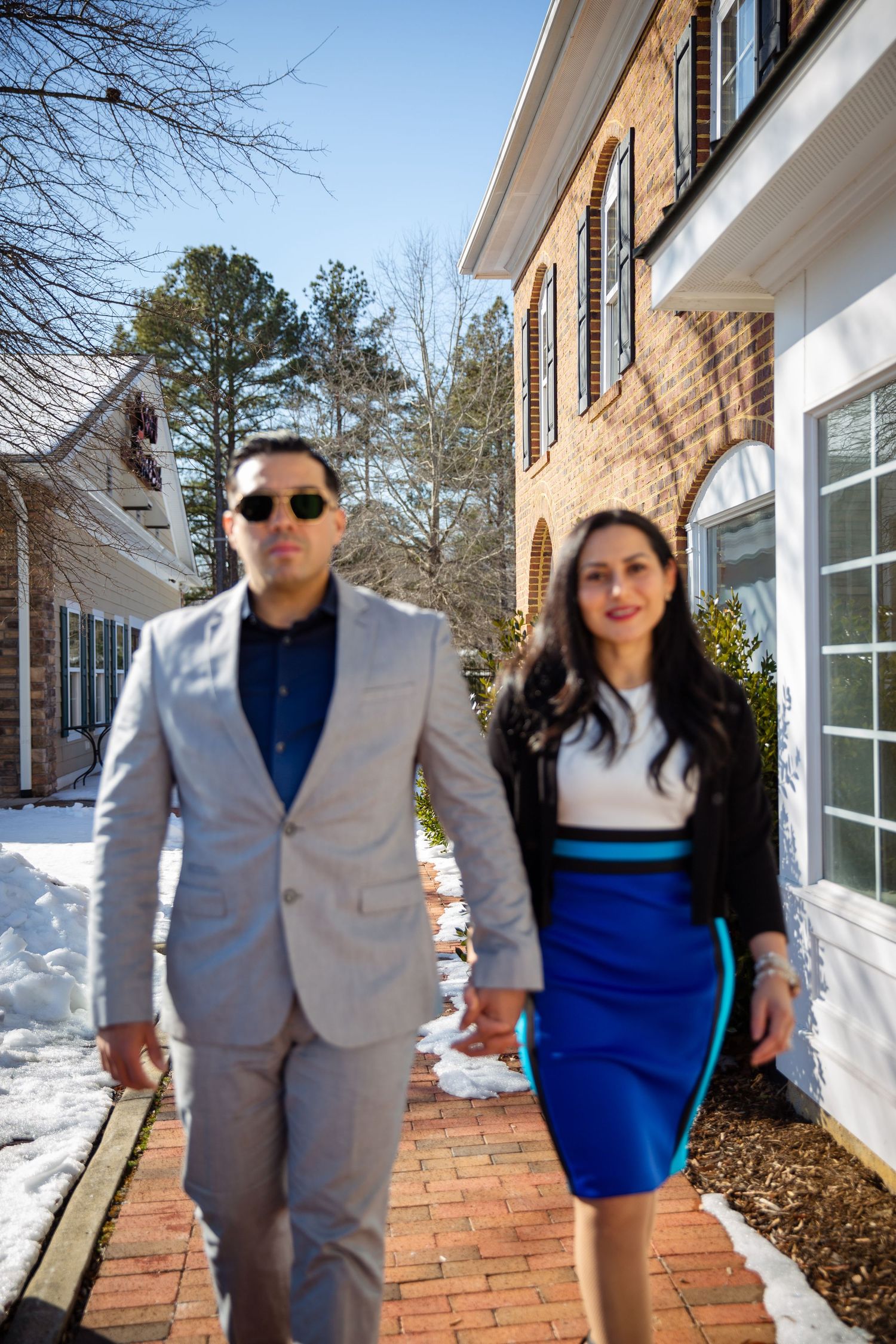 Couple walking by a beautiful building