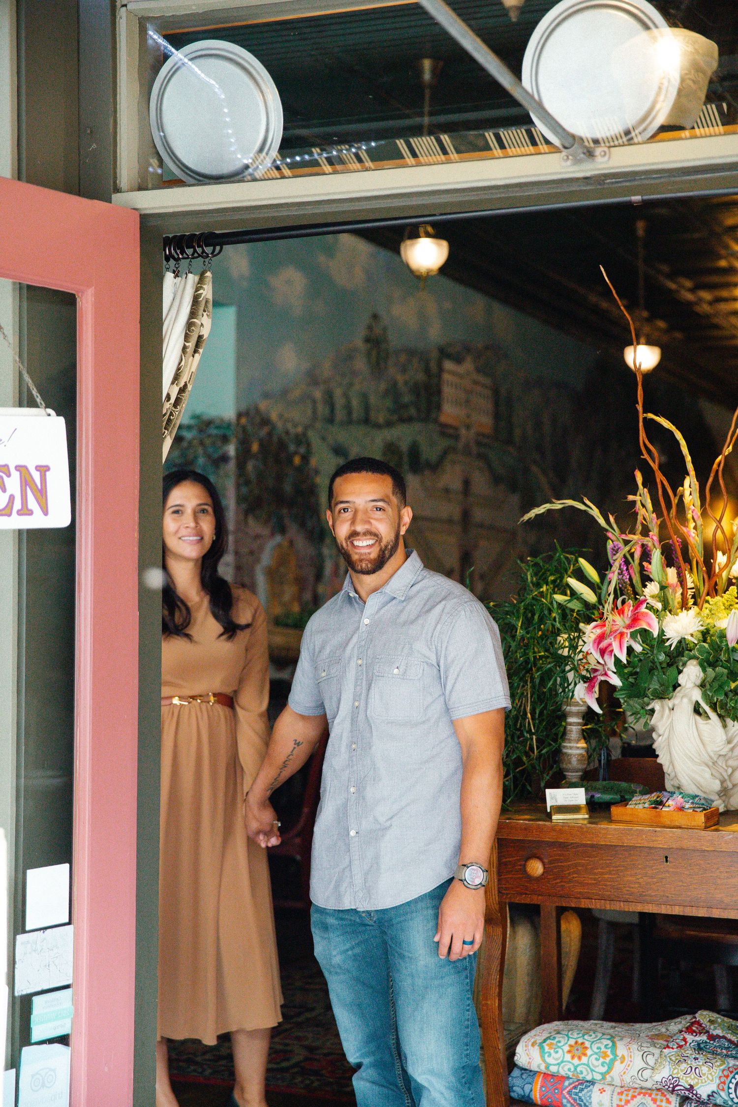 Couple walking out a cafe