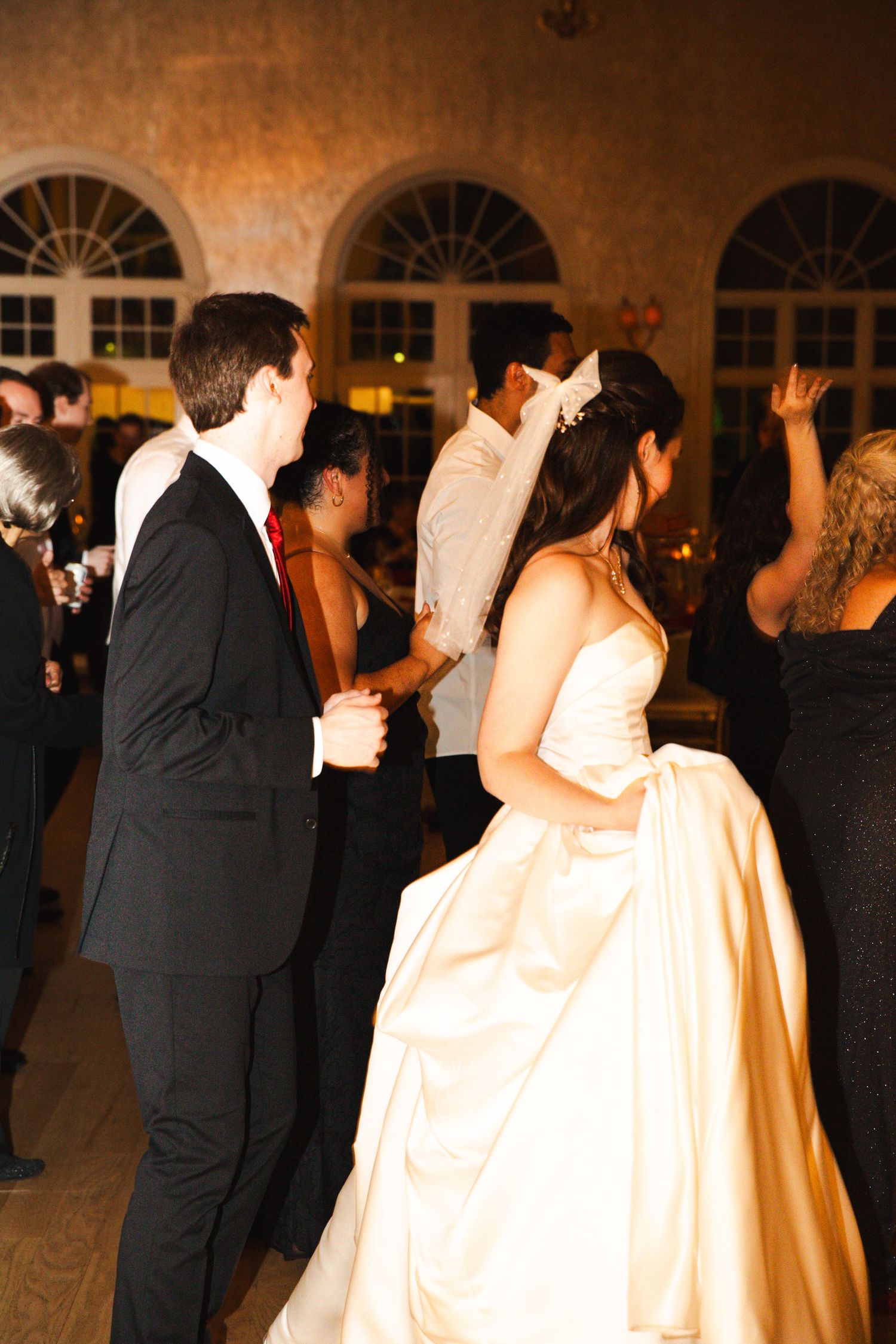 Bride and groom share a romantic dance at elegant wedding reception.