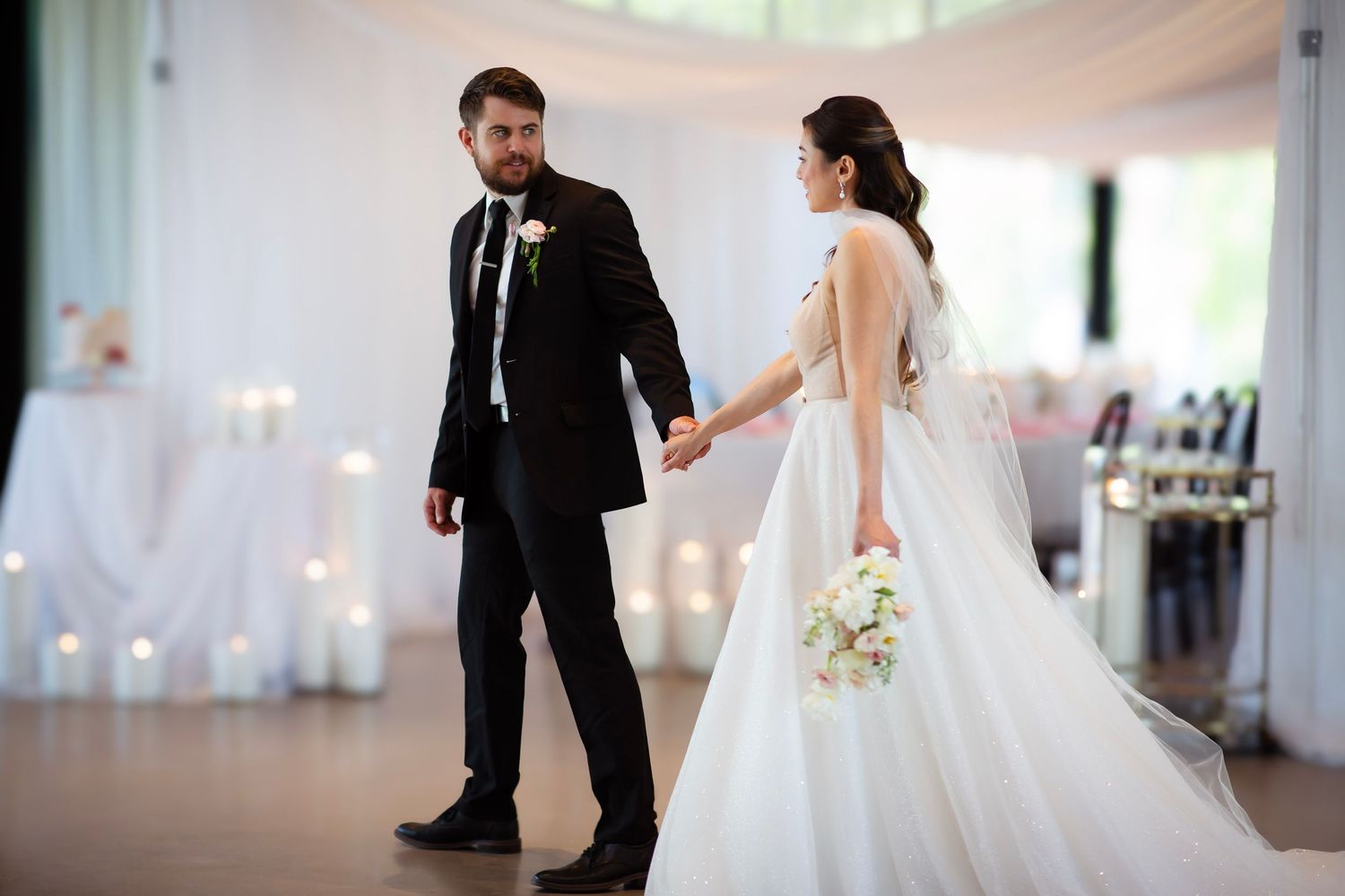 Groom leading bride in a leisurely walk