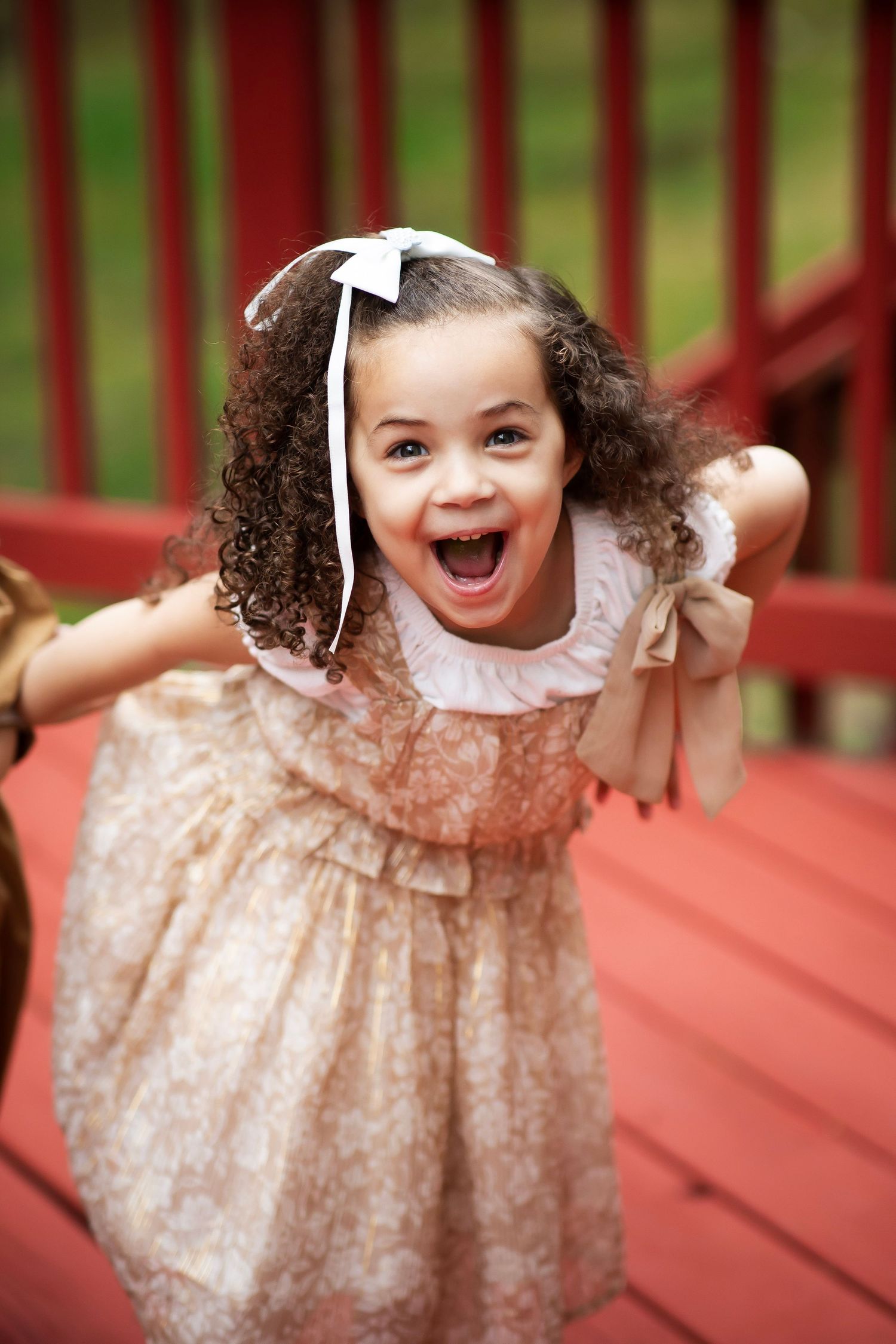 Little girl with wide mouth laugh
