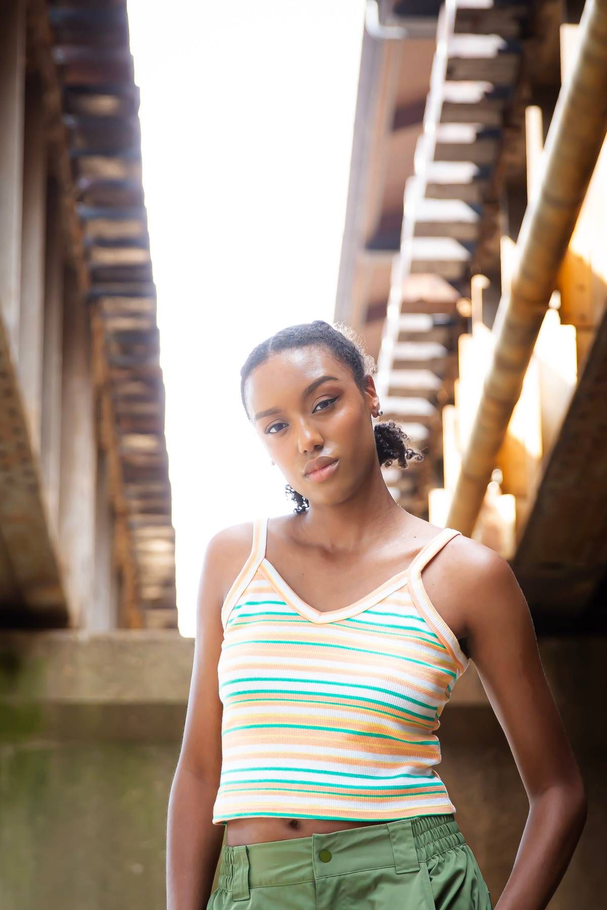 Female model under train tracks