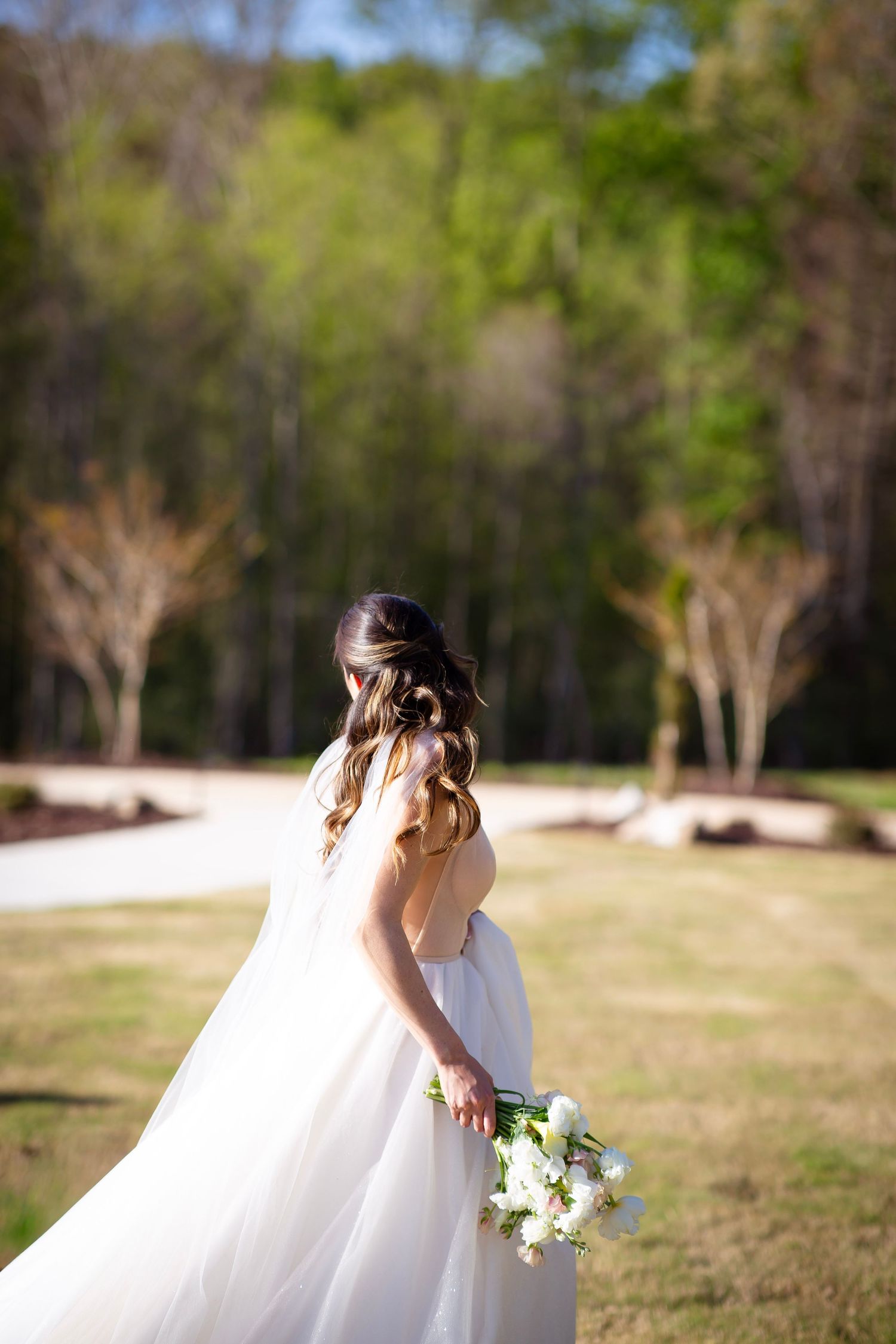 Bride looking behind her in a free spirited run