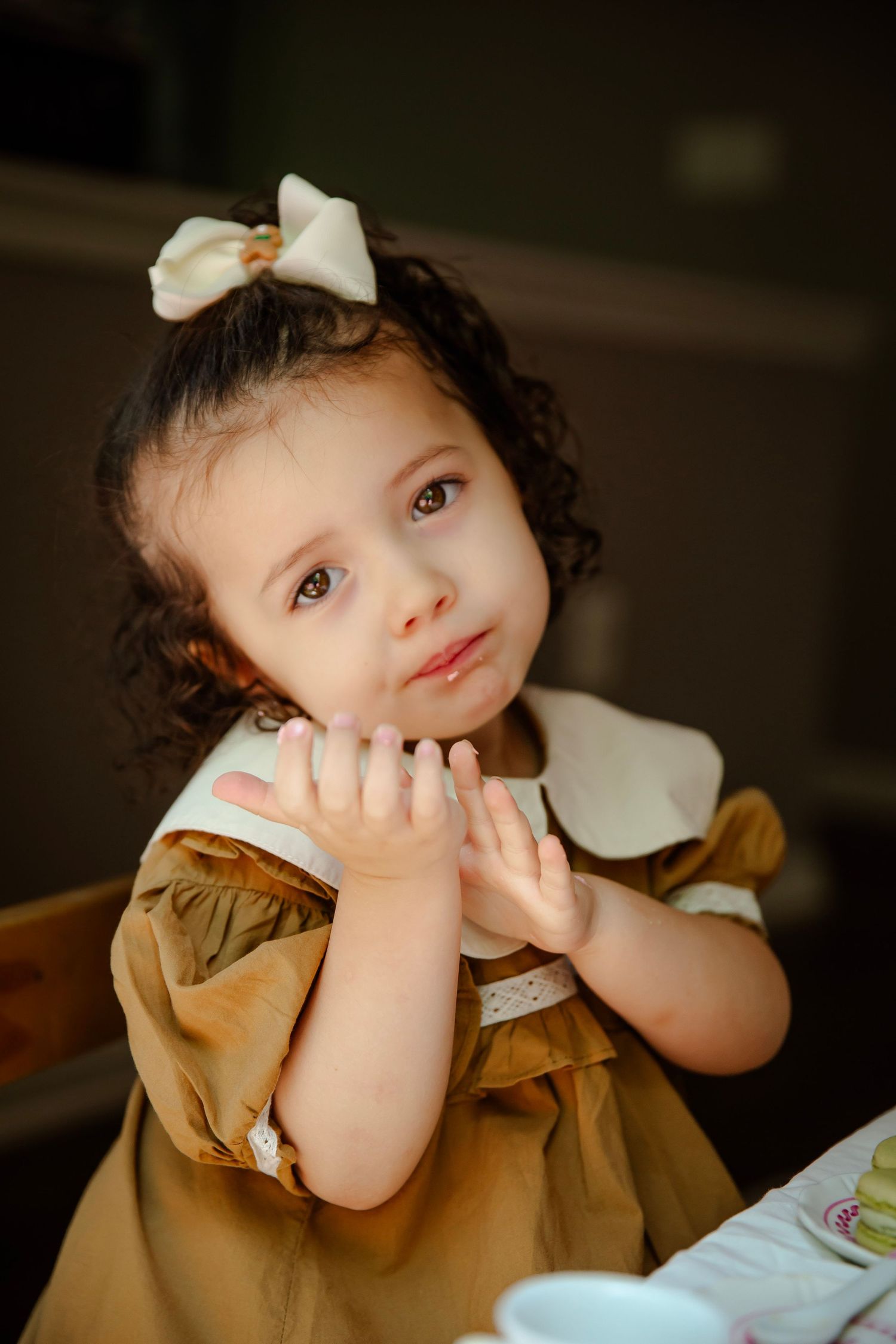 Toddler girl in cute head tilt pose