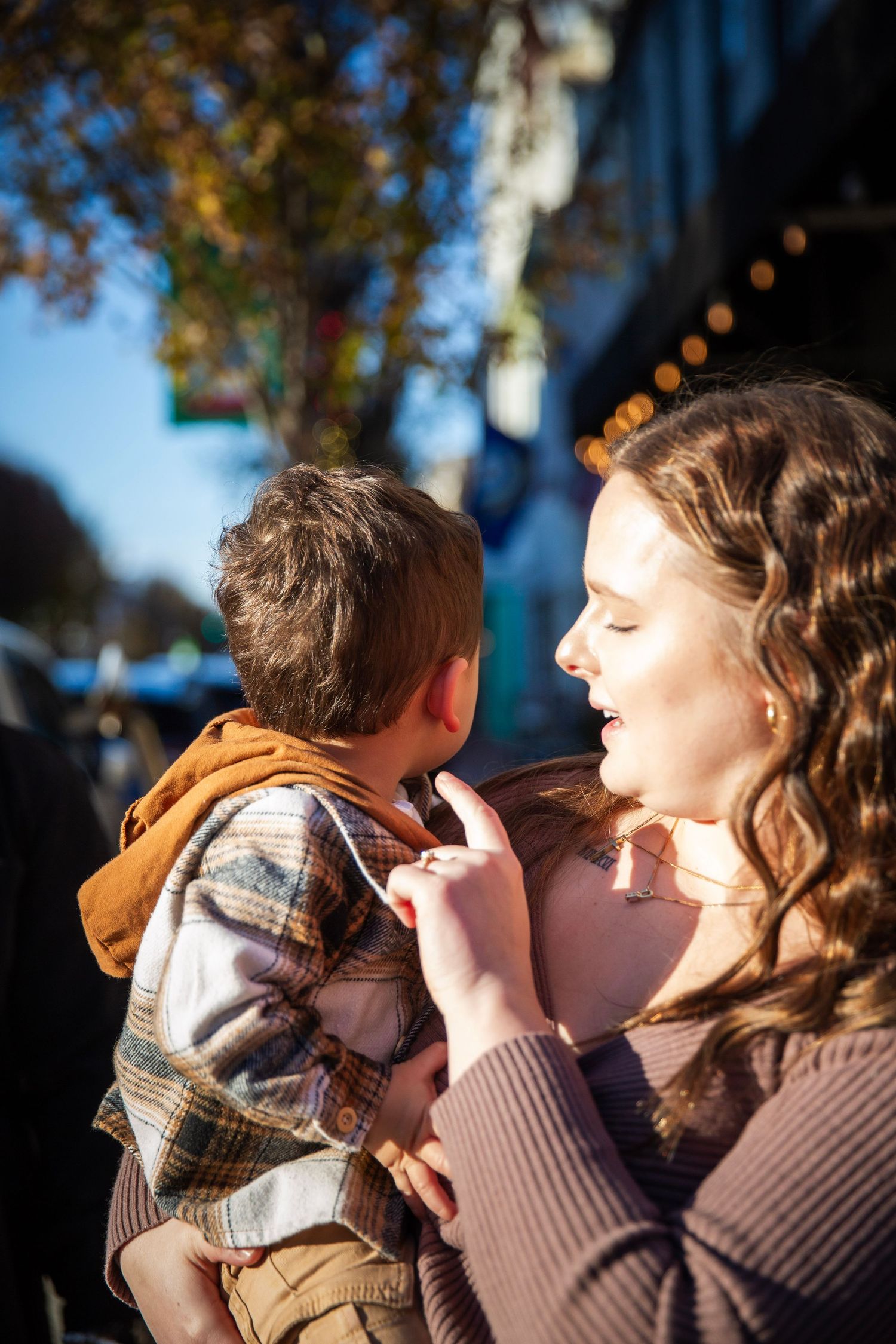 Family  of three sharing a moment in golden hour