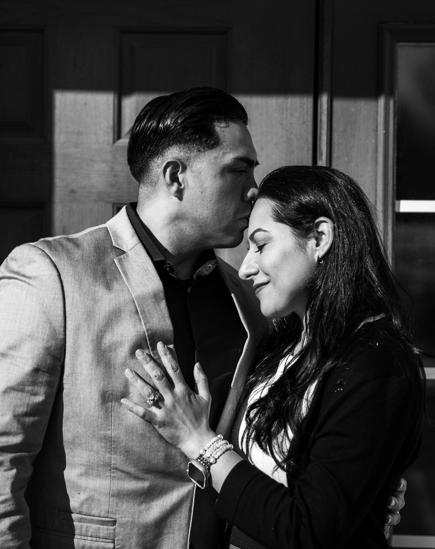 Couple with man kissing woman's forehead