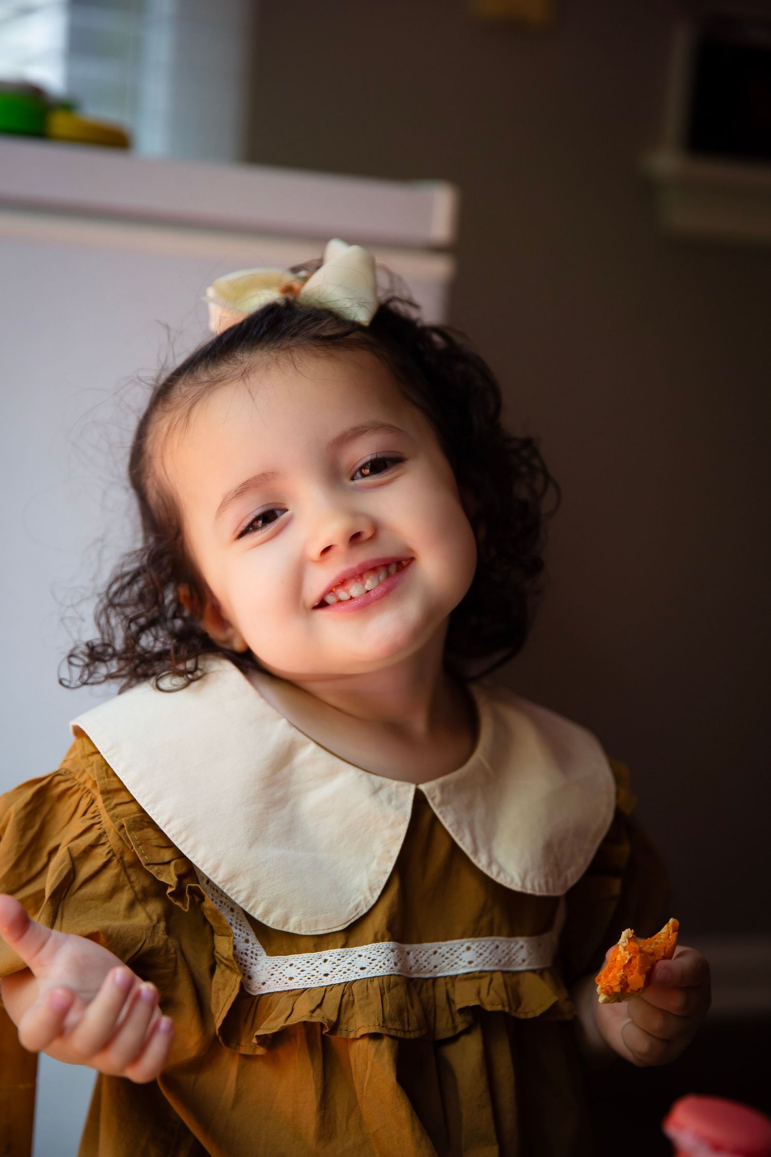 toddler girl with play tea set