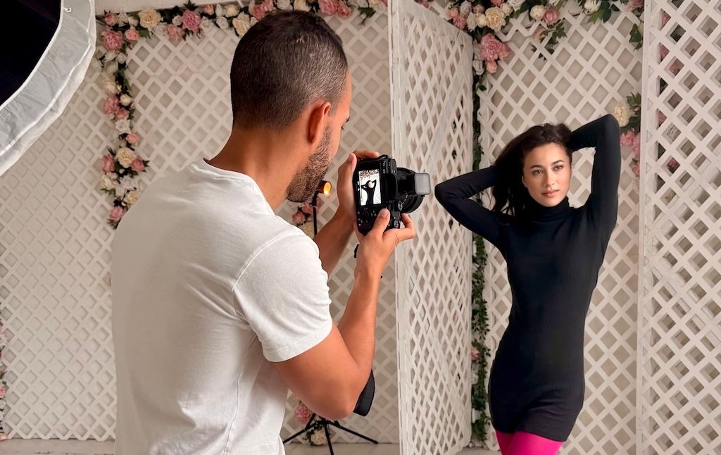 Photographer taking photos of model