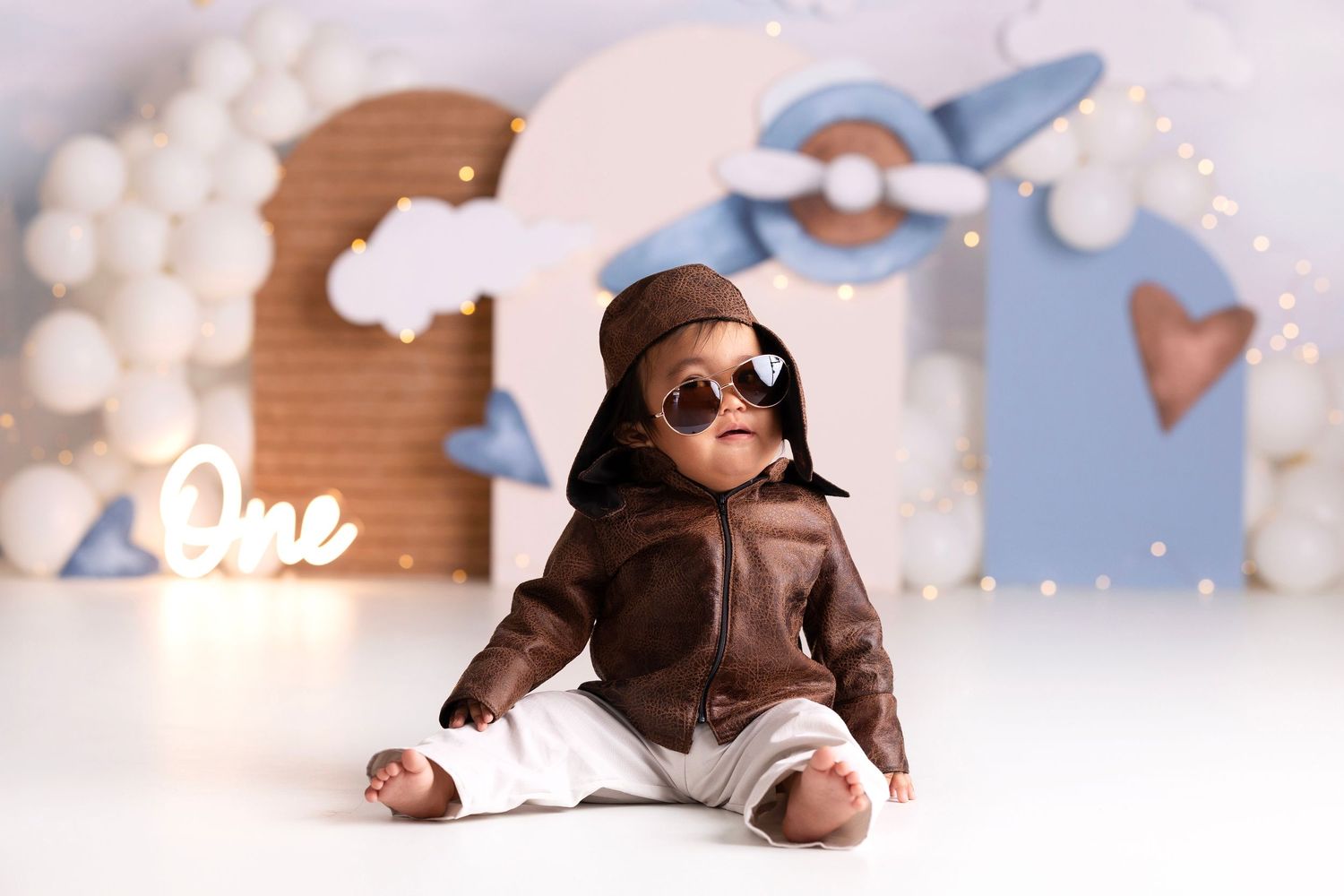 Pilot theme cake smash session for one year old baby boy in Vacaville studio